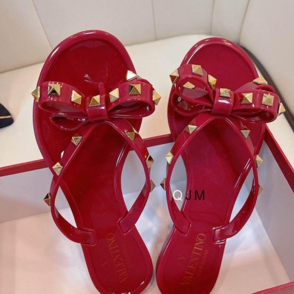 Valentino Garavani PVC Jelly Rockstud Bow Thong Sandals in Red